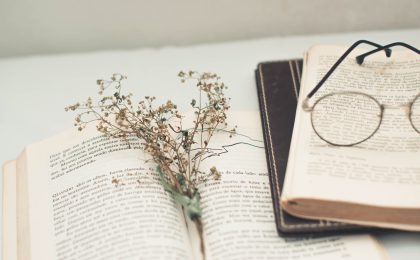 black framed eyeglasses on book page